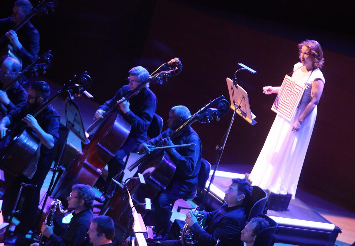 Soloist Sasha Cooke, right, onstage with the L.A. Philharmonic in performance of Philip Glass' score to Rome section of Robert Wilson's "The CIVIL warS."