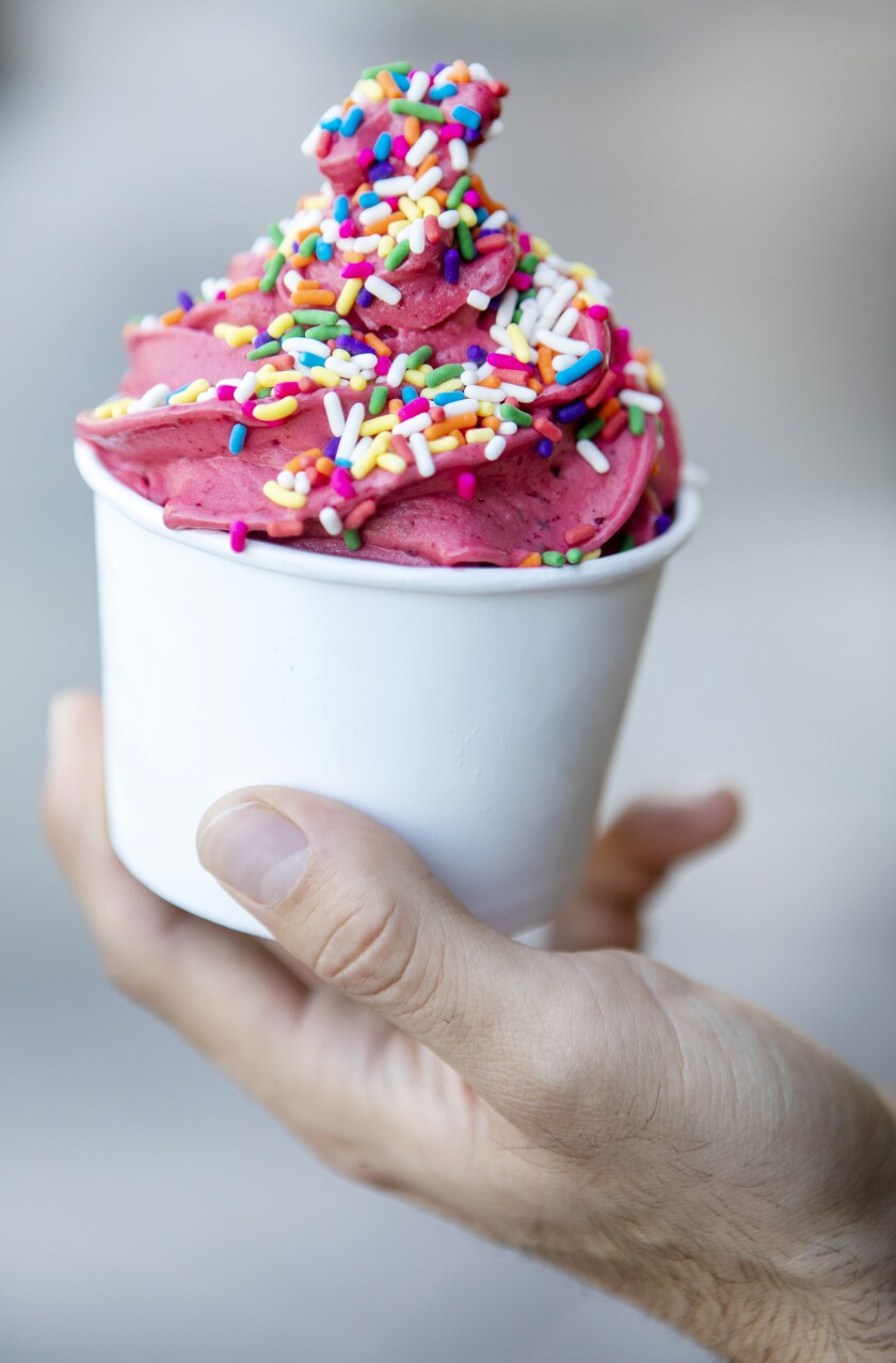 A swirl of raspberry frozen yogurt from Humphrey Yogart with multicolored sprinkles.