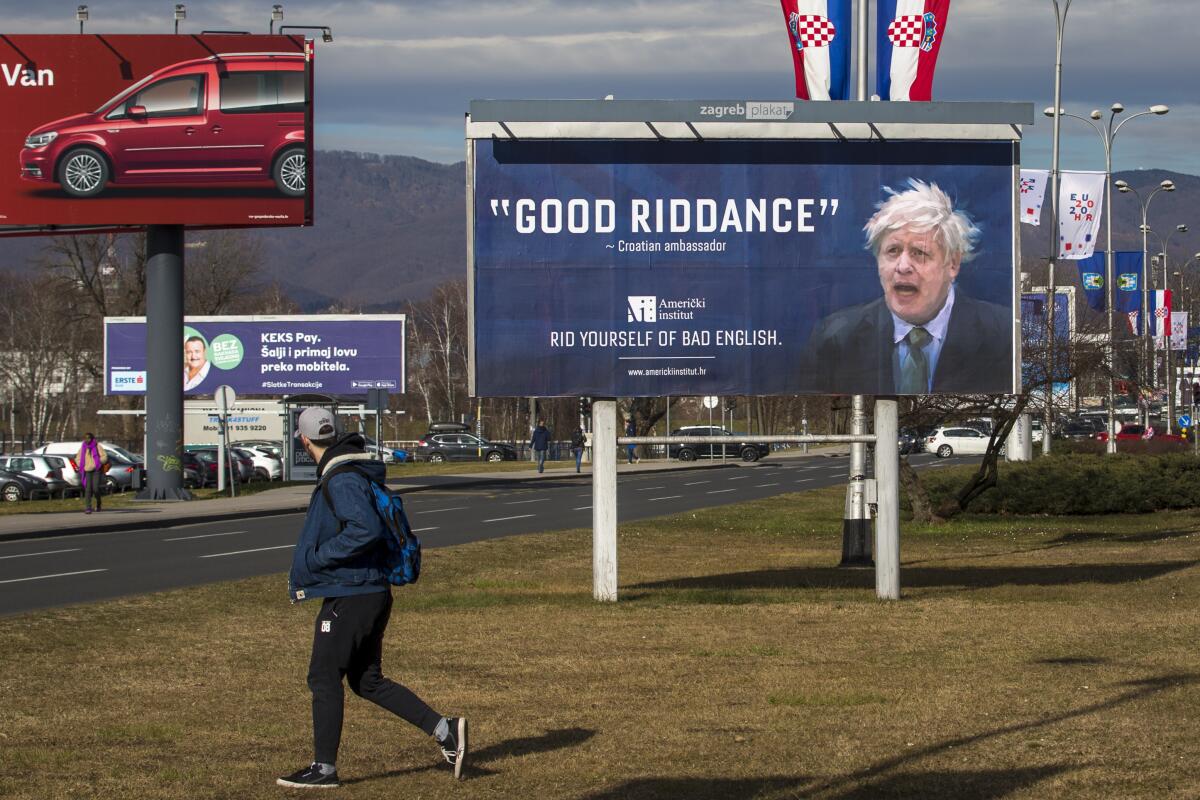 FILE - An advertising billboard for an English language school depicts Britain's prime minister Boris Johnson, in Zagreb, Croatia, Feb. 6, 2020. Outgoing U.K. Prime Minister Boris Johnson has been the bane of Brussels for many years, from his days stoking anti-European Union sentiment with exaggerated newspaper stories to his populist campaign leading Britain out of the bloc and reneging on the post-Brexit trade deal he himself signed. (AP Photo/Darko Bandic, file)