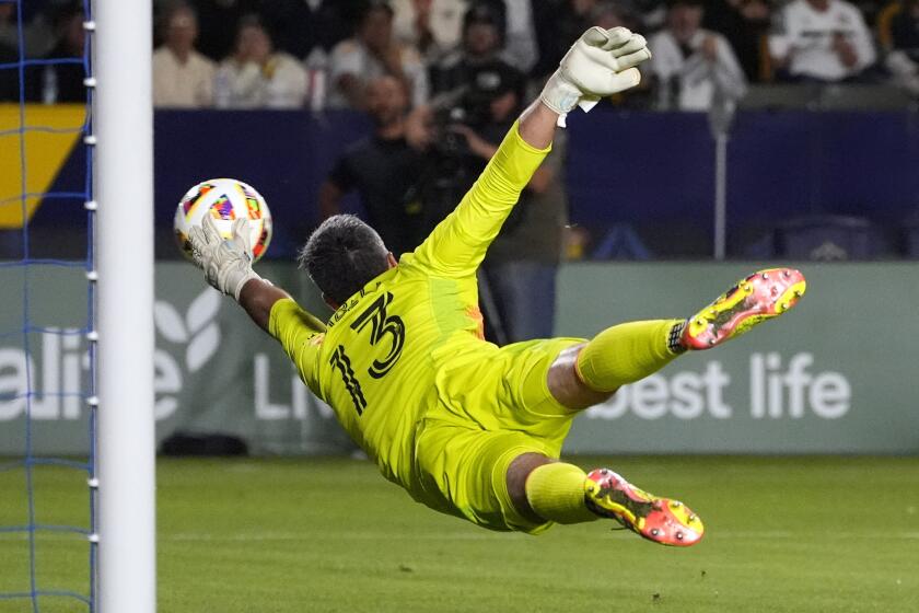 Houston Dynamo goalkeeper Andrew Tarbell can't reach a ball kicked for a goal by Los Angeles Galaxy midfielder Riqui Puig during the second half of a Major League Soccer match Saturday, May 25, 2024, in Carson, Calif. (AP Photo/Mark J. Terrill)