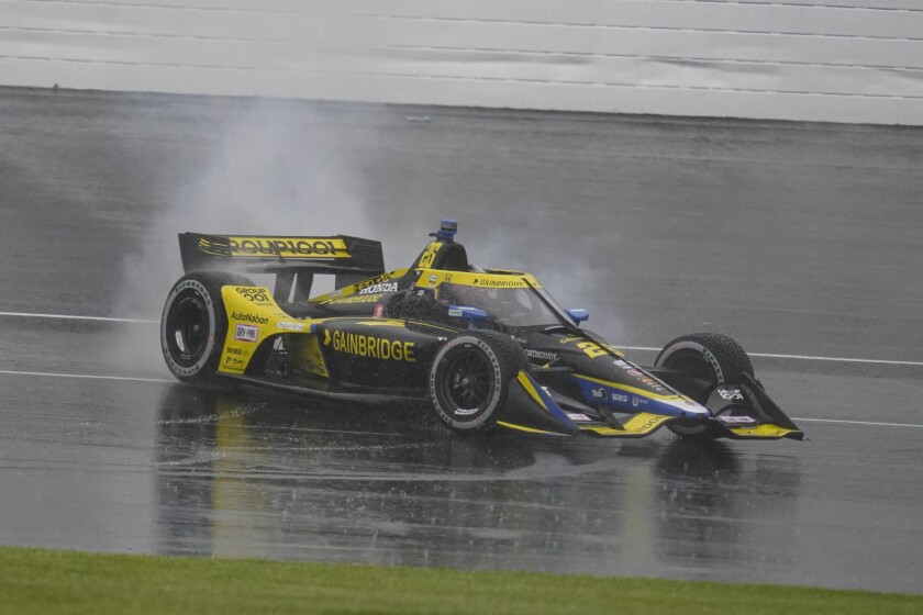Colton Herta spins his car after winning the IndyCar Grand Prix race at Indianapolis Motor Speedway on May 14, 2022.