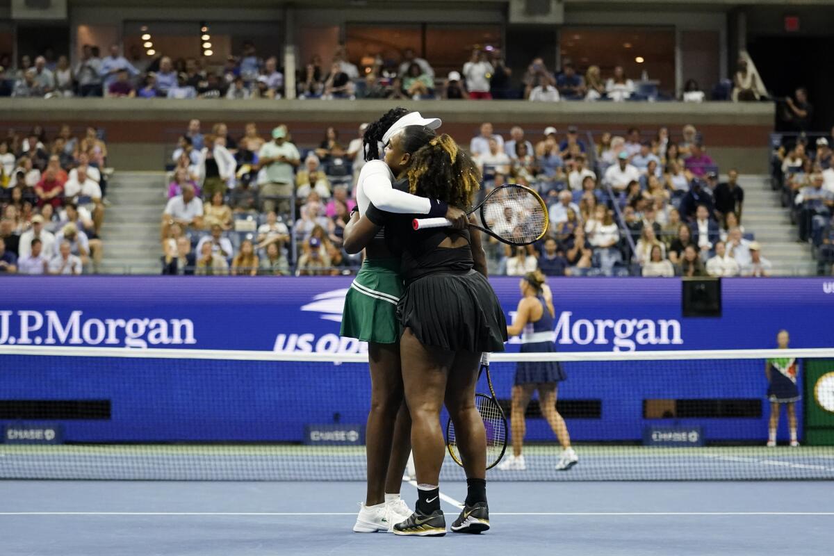 Serena Williams, right, and Venus Williams, of the United States, embrace after a loss in their first-round doubles match against Lucie Hradecká and Linda Nosková, of the Czech Republic, at the U.S. Open tennis championships, Thursday, Sept. 1, 2022, in New York. (AP Photo/Charles Krupa)