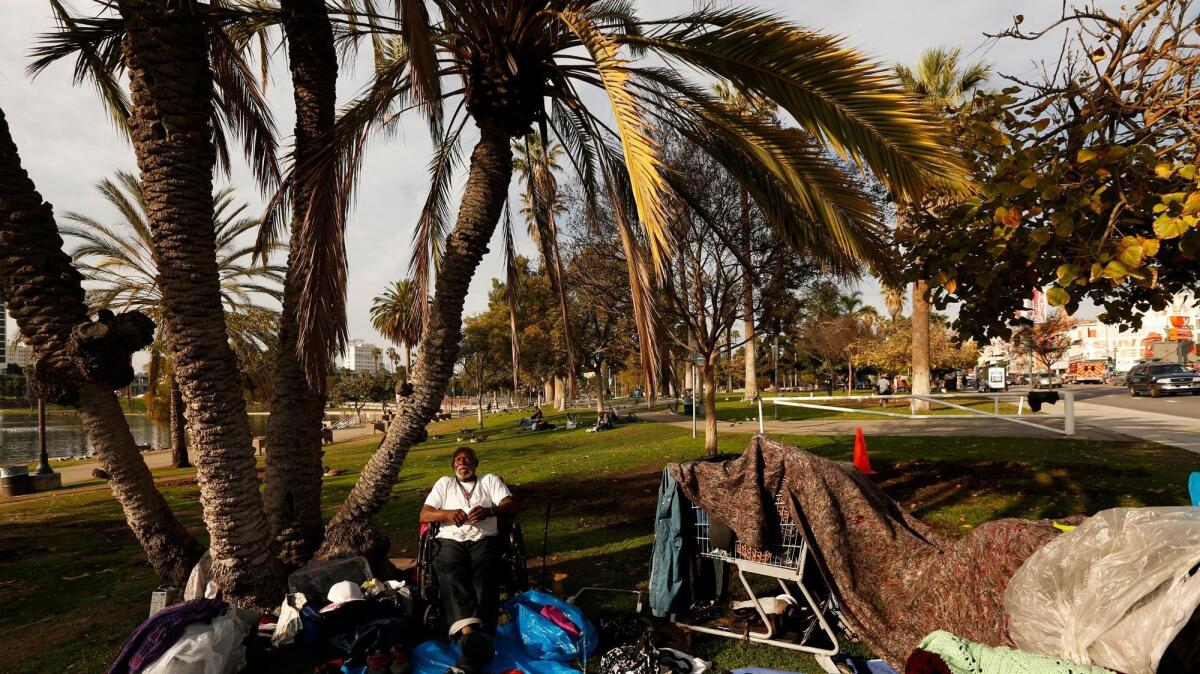 Residents of a homeless encampment in MacArthur Park in February.