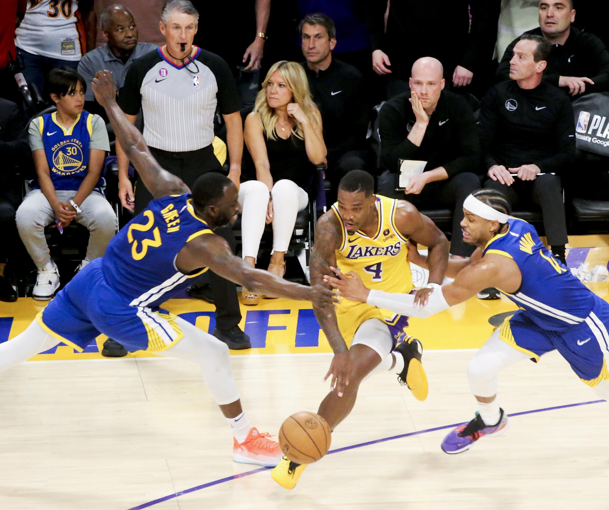 Lakers guard Lonnie Walker IV gets fouled while trying to run out the clock on a 104-101 victory over the Warriors.
