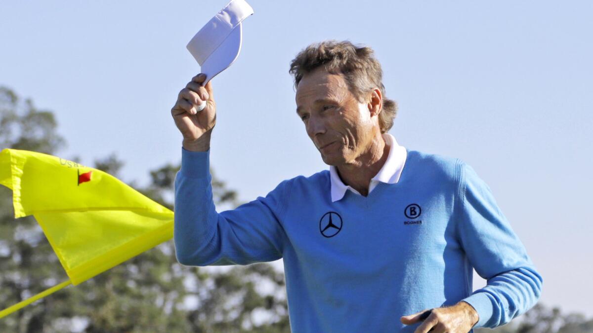 Bernhard Lange tips his cap to the crowd after putting out at No. 18 during the third round of the Masters on Saturday.