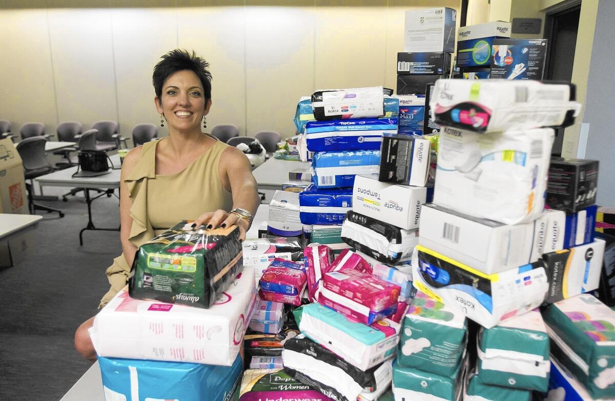Gina Jackson helped collect more than a thousand feminine hygiene products for poor or unemployed women during a drive at a Tustin brewery.