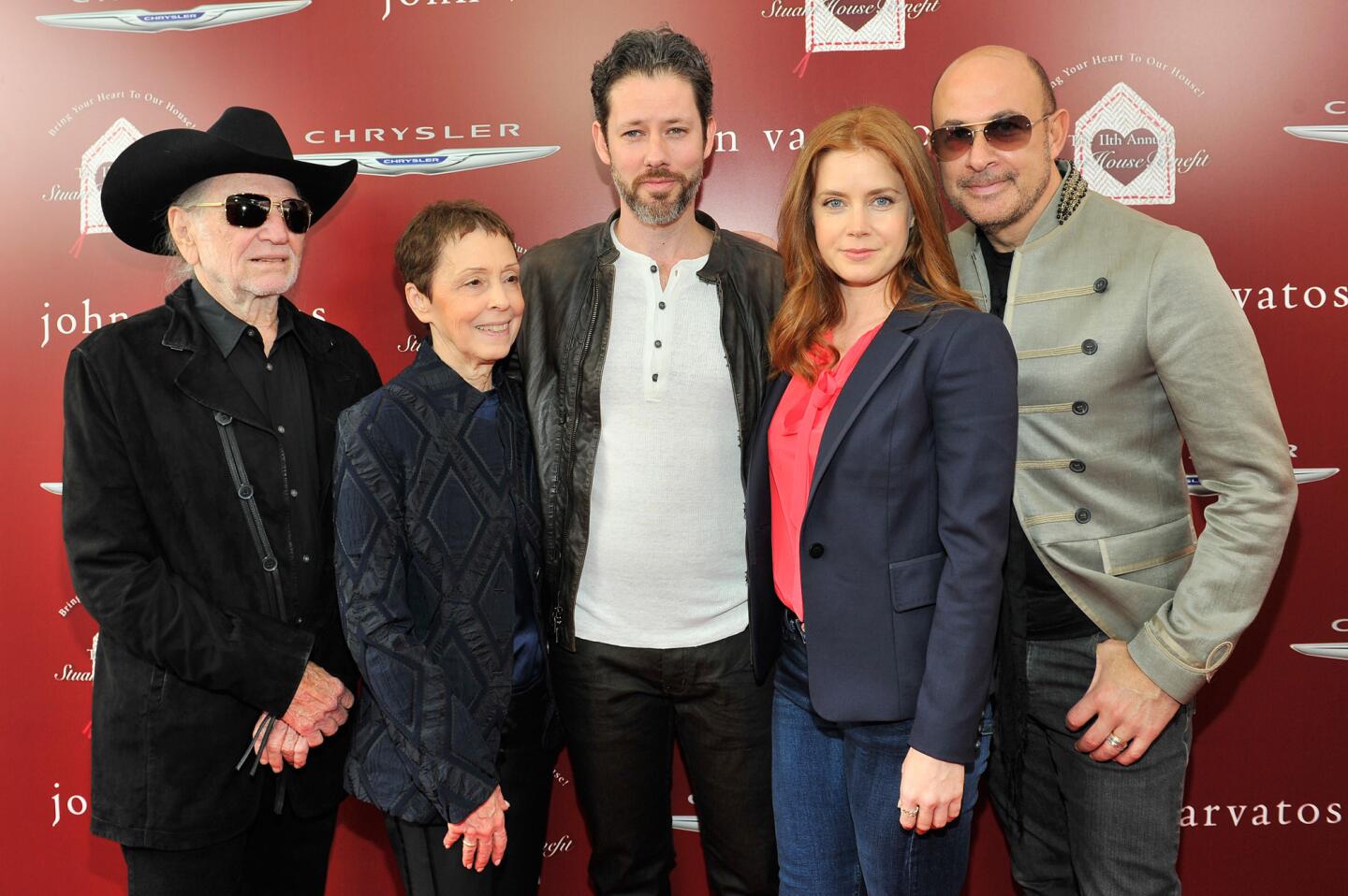 The 11th annual Stuart House benefit drew together this quintet: from left, Willie Nelson, Stuart House founder Gail Abarbanel, actor-artist Darren Le Gallo, Amy Adams and designer-event host John Varvatos. The Sunday event raised a record $939,000 for the agency that assists sexually abused children and their families.