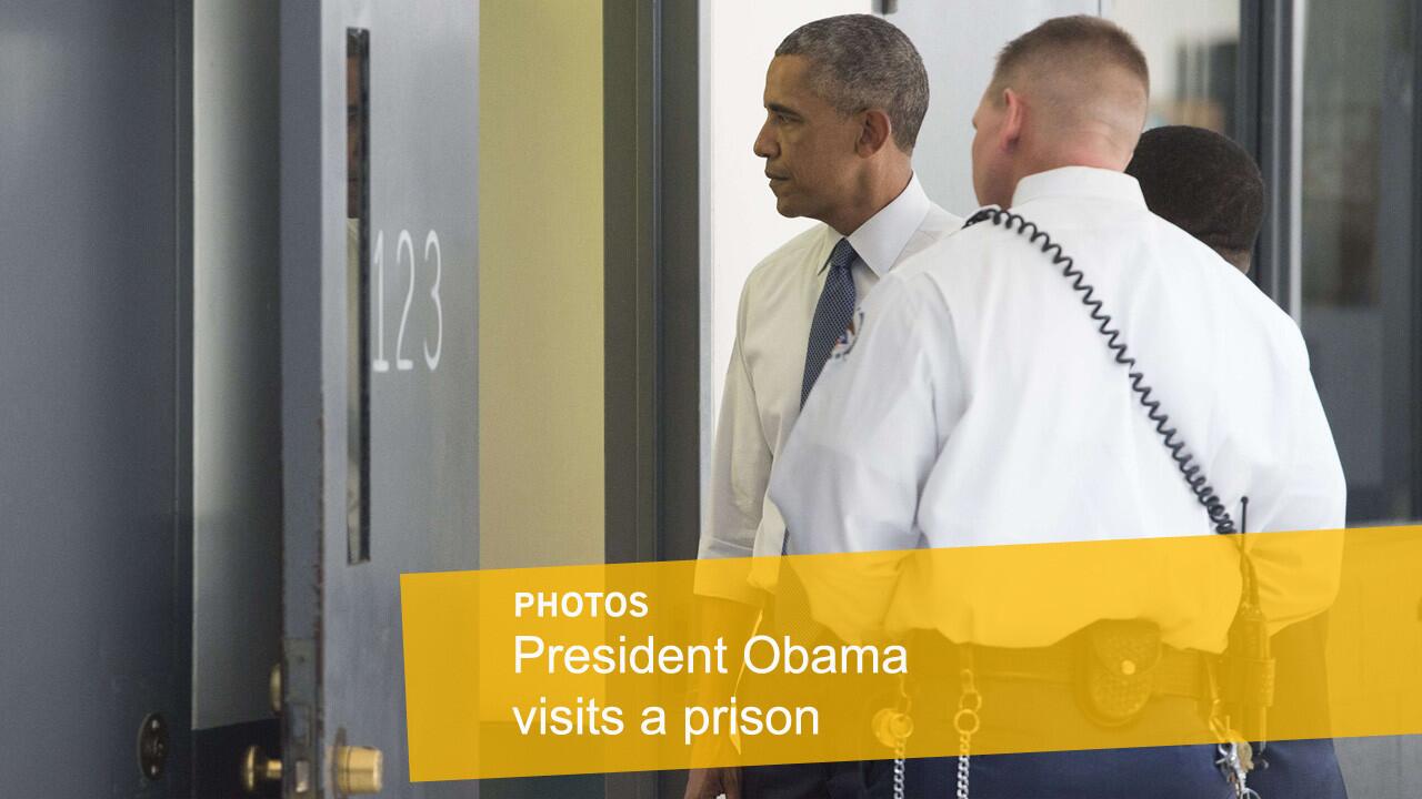 President Barack Obama looks into a prison cell with correctional officer Ronald Warlick as he tours a cell block at the El Reno Federal Correctional Institution in El Reno, Okla., on Thursday.