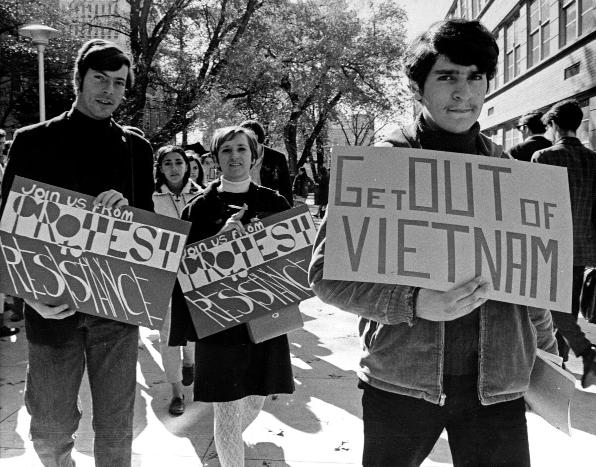 Students hold signs at a Vietnam War protest in 1967