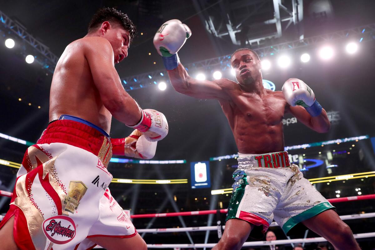 Errol Spence Jr., right, throws a punch at Mikey Garcia during their IBF world welterweight championship bout in March.