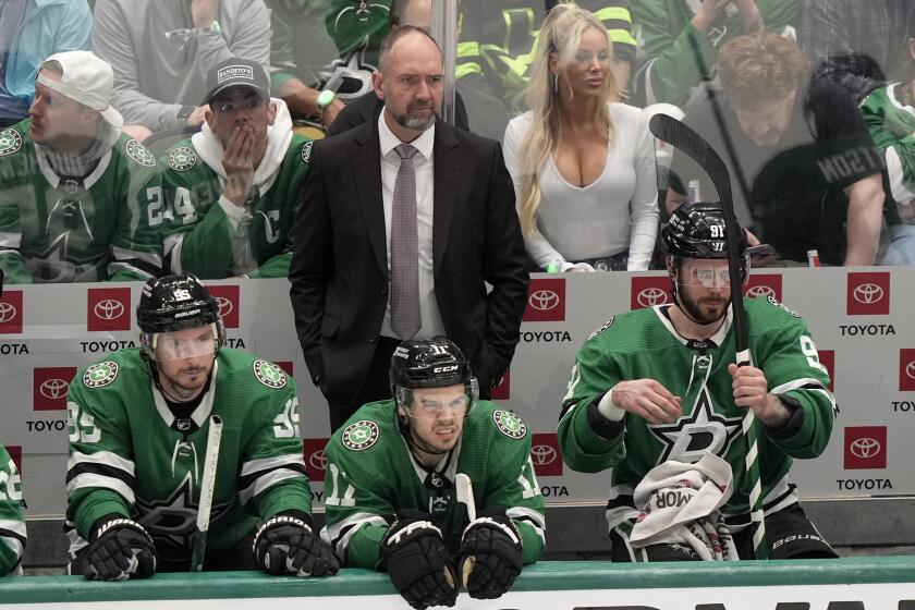Dallas Stars head coach Pete DeBoer, center standing, Matt Duchene (95), Logan Stankoven (11) and Tyler Seguin (91) watch play in the third period in Game 2 of an NHL hockey Stanley Cup second-round playoff series against the Colorado Avalanche in Dallas, Tuesday, May 7, 2024. (AP Photo/LM Otero)