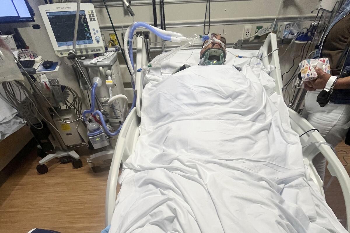 A man in a hospital bed.