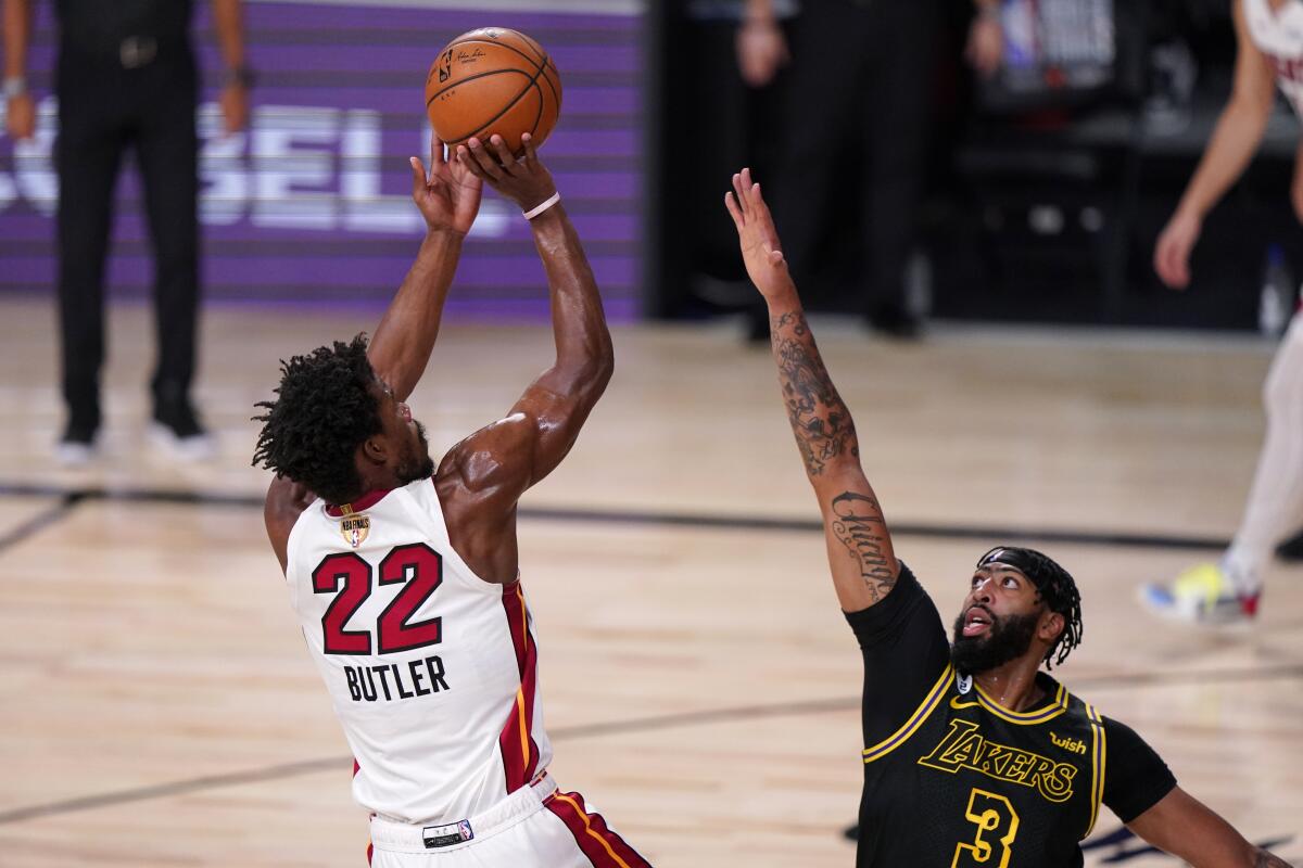 Heat forward Jimmy Butler elevates for a jumper over Lakers forward Anthony Davis during Game 2.