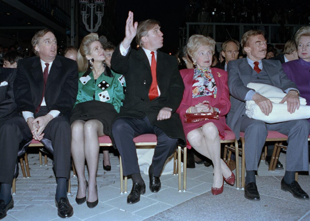 Robert Trump, far left, and his wife, Blaine, attend the grand opening of the Taj Mahal Casino Resort