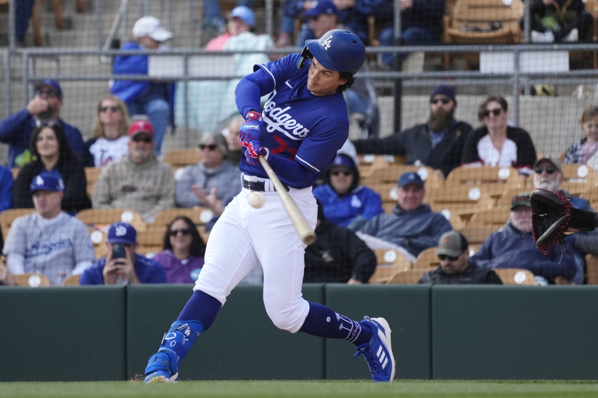 James Outman connects for a single during a Dodgers spring training game.