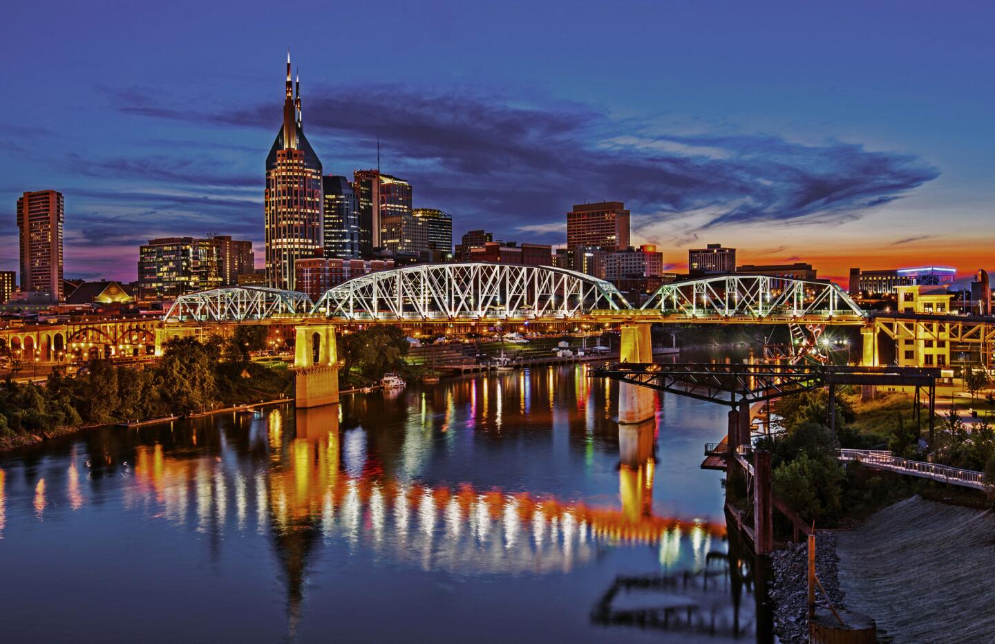 Twilight settles over the Cumberland River and downtown Nashville.