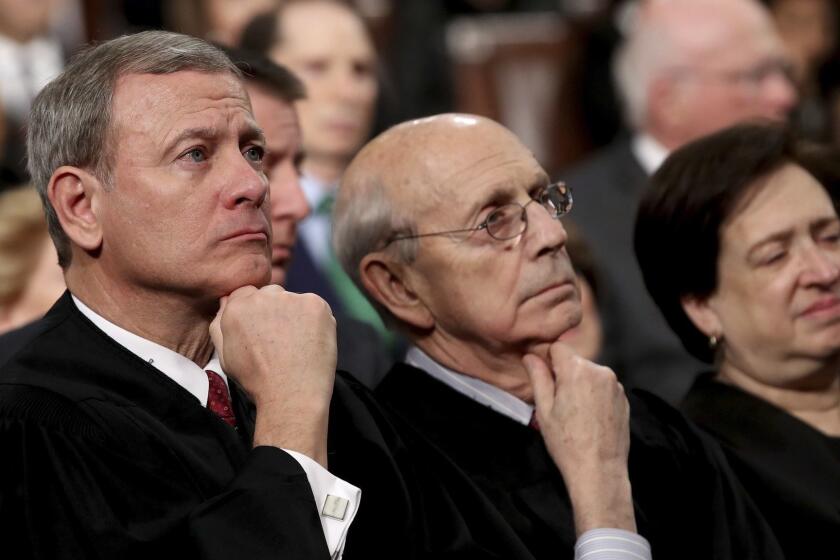 U.S. Supreme Court Chief Justice John Roberts, from left, Associate Justice Stephen Breyer, and Associate Justice Elena Kagan listens as President Donald Trump delivers his first State of the Union address in the House chamber of the U.S. Capitol to a joint session of Congress Tuesday, Jan. 30, 2018 in Washington. (Win McNamee/Pool via AP)