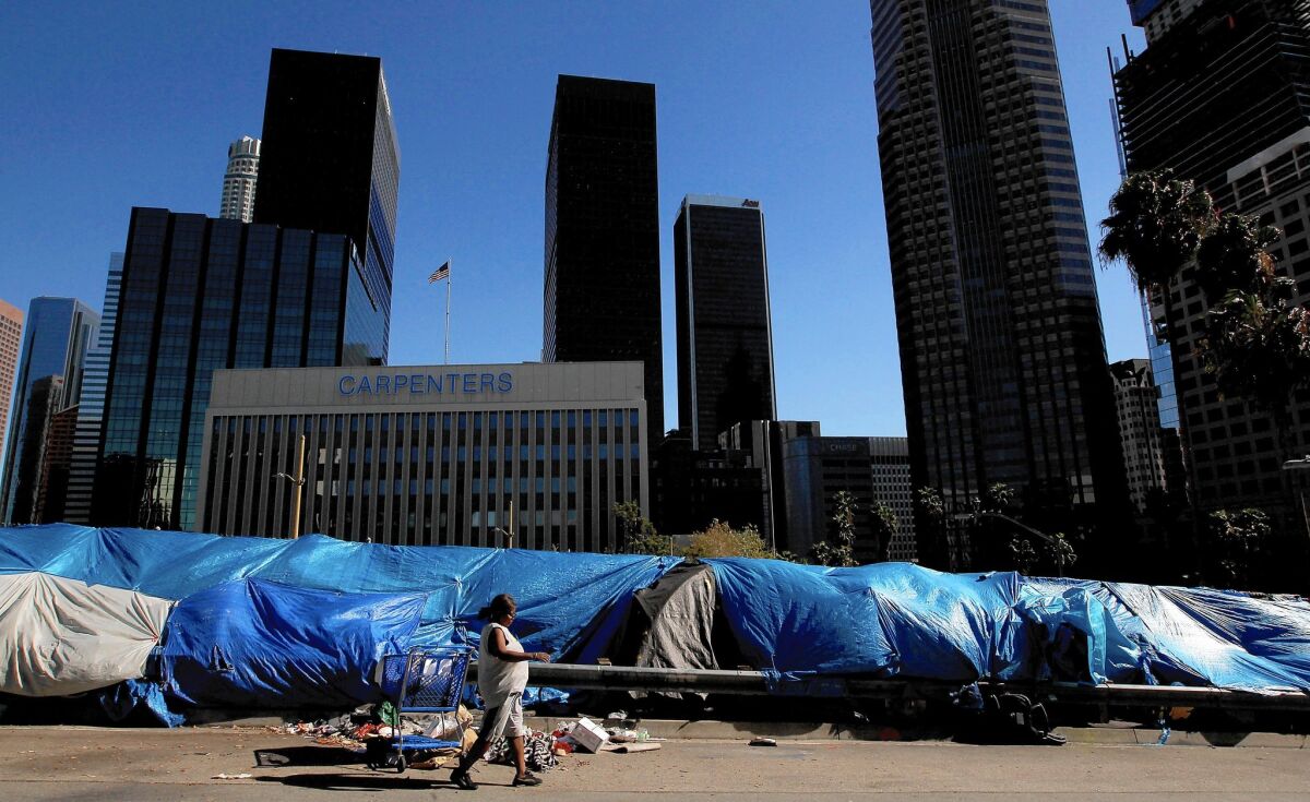 Shown is a homeless encampment in downtown L.A. at Beaudry Avenue and 6th Street. Los Angeles County supervisors voted Tuesday to put up to $100 million a year into a fund for affordable housing.
