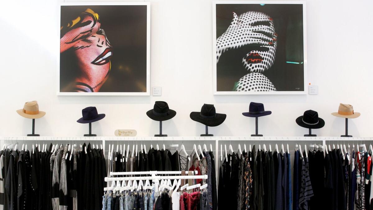 Gladys Tamez Millinery hats and assorted designer clothes are sold at Ron Robinson's Santa Monica store.