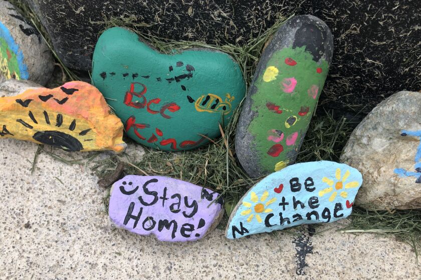Inspirational messages painted on rocks in a Santa Clarita neighborhood during the COVID-19 pandemic in April 2020.