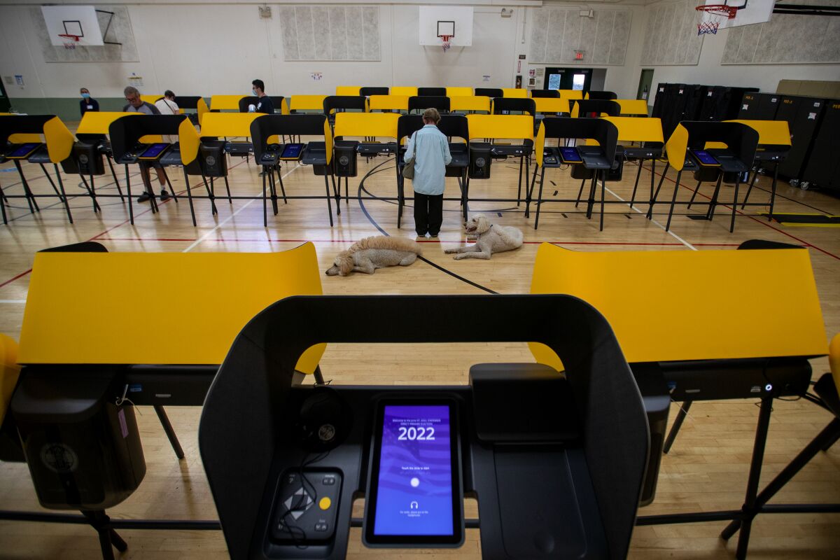 A voter casts a ballot in the California primary election