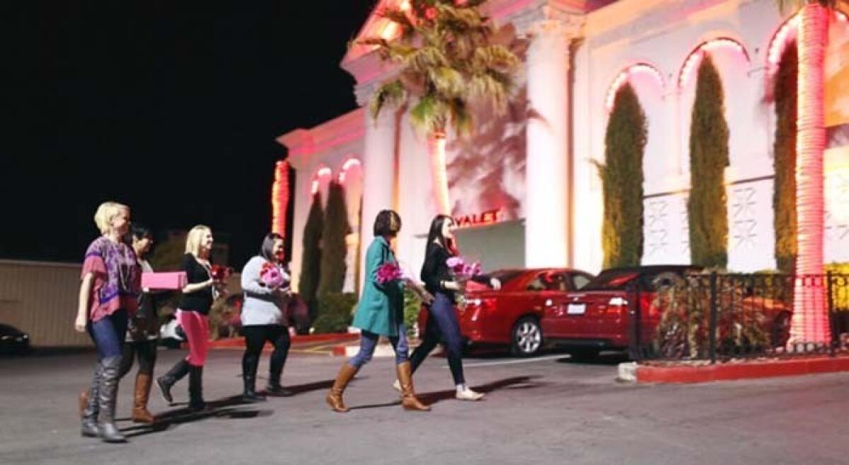 A group of volunteers with a nonprofit called the Cupcake Girls arrive at the Crazy Horse Three men's club in Las Vegas to deliver cupcakes to dancers there.