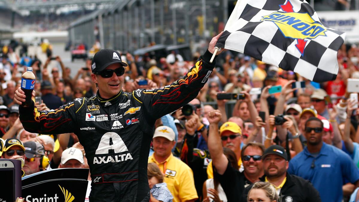 Jeff Gordon celebrates after winning the NASCAR Brickyard 400 for the fifth time at Indianapolis Motor Speedway on Sunday.