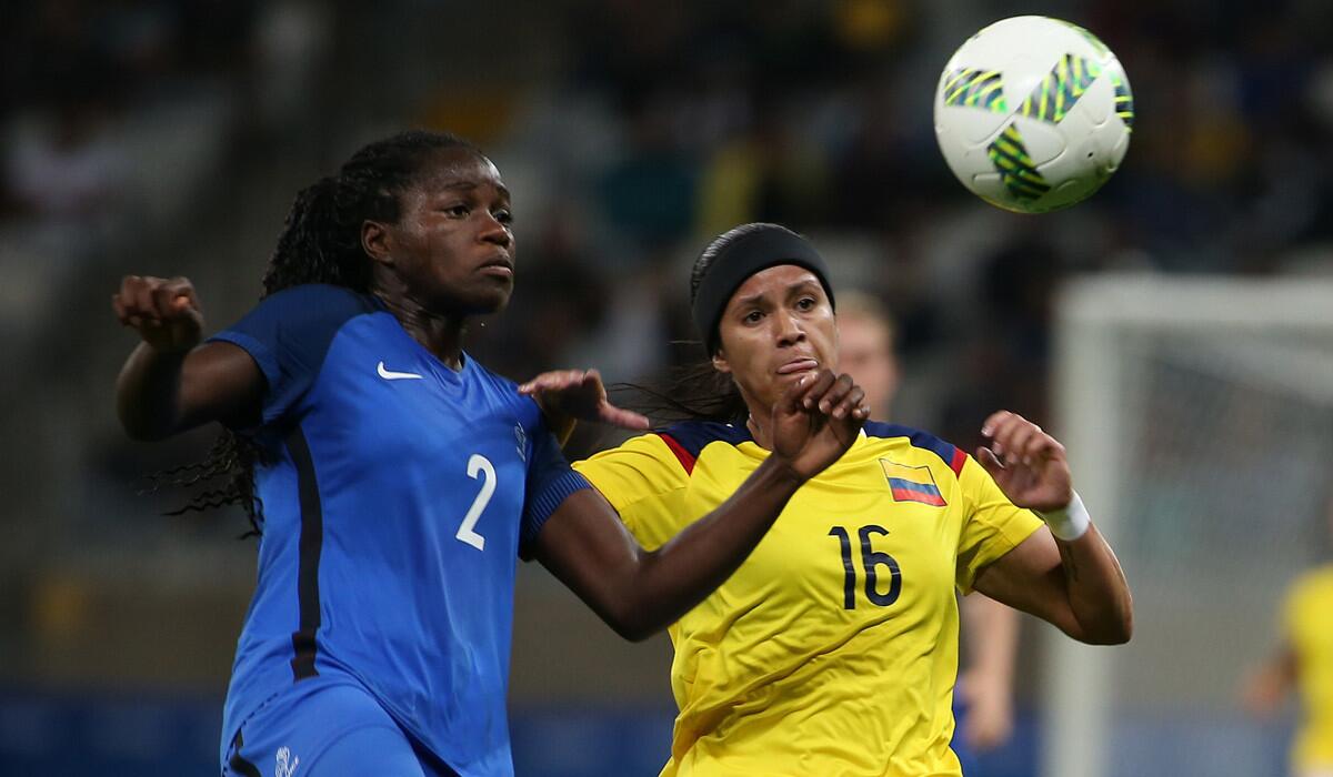 France's Griedge Mbock Bathy, left, fights for the ball with Colombia's Lady Andrade during the match at the Mineirao stadium in Belo Horizonte, Brazil, on Wednesday.