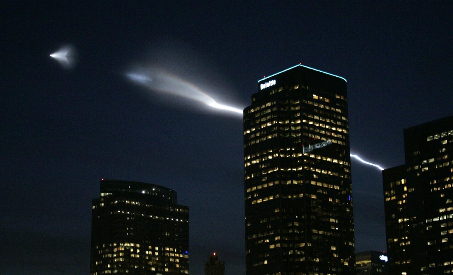 A Minotaur I rocket carrying an Air Force satellite into orbit creates a spectacular display as it streaks above downtown Los Angeles in September 2005.