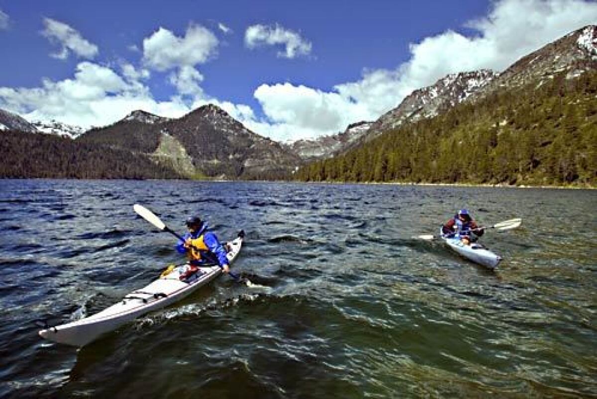 Bob Kingman, left, and Dennis Liebl, paddle out of Emerald Bay on Lake Tahoe.