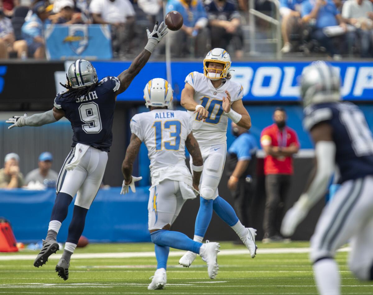  Cowboys linebacker Jaylon Smith, tries to block a pass by the Chargers'  Justin Herbert.