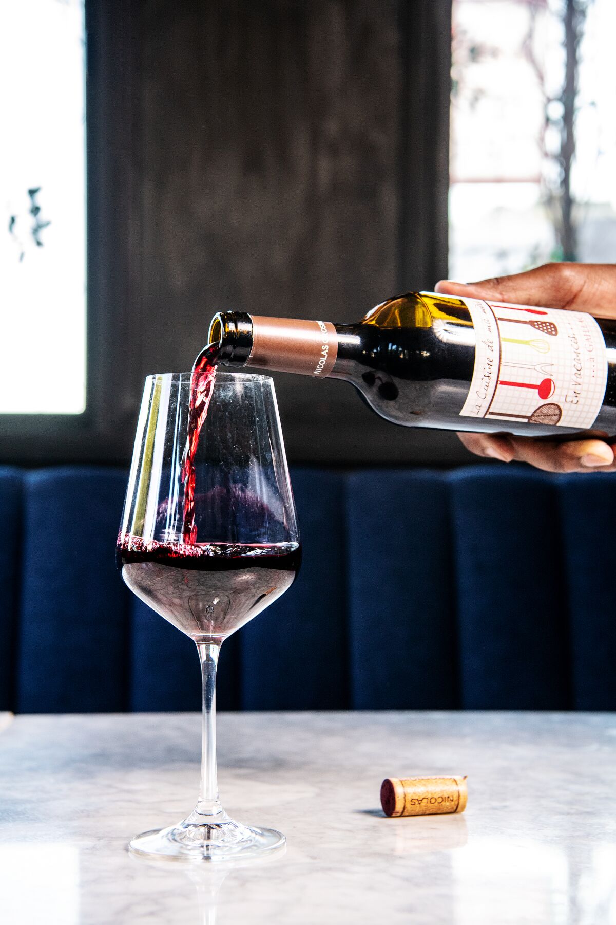 Wine being poured into a glass at Fellow Traveler in West Hollywood.