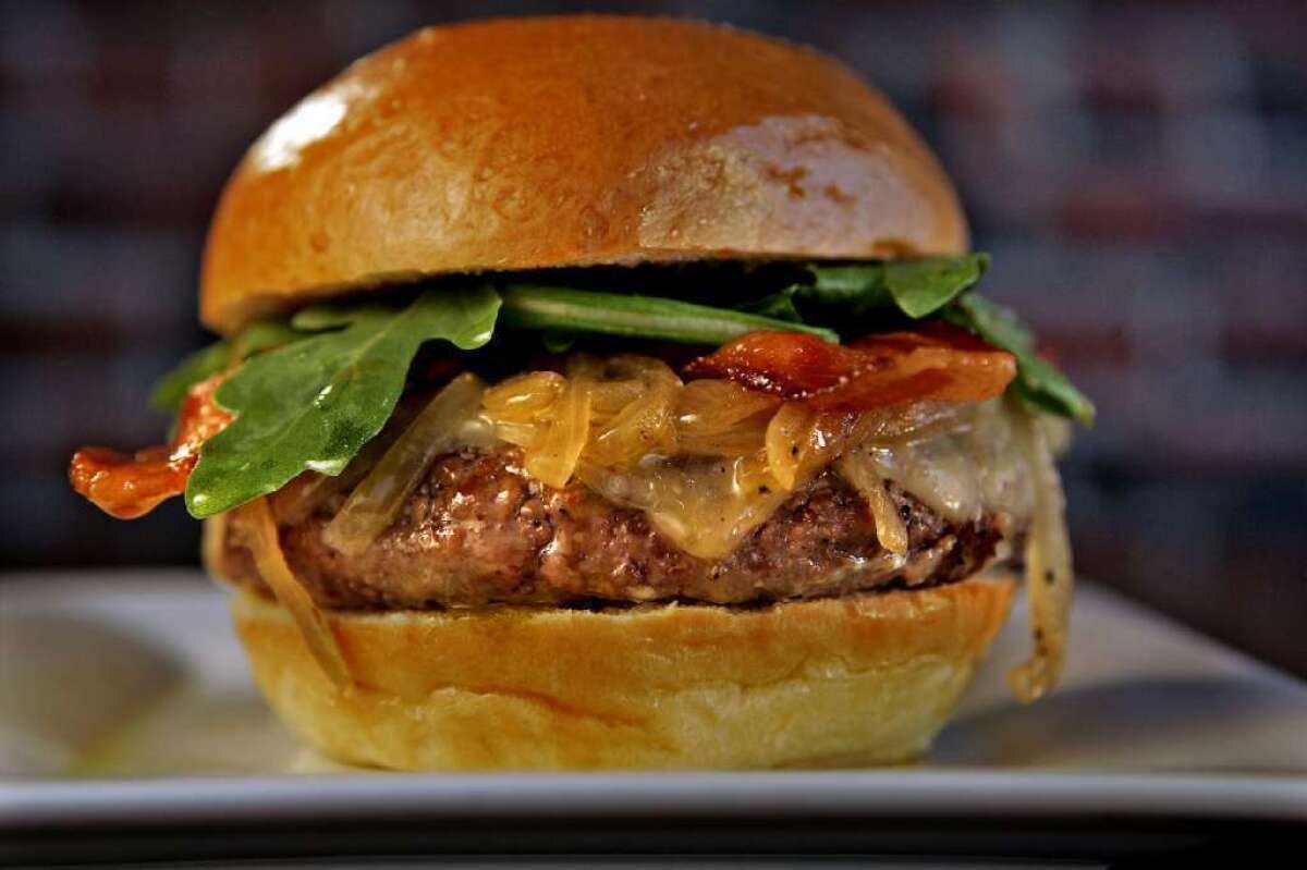 Golden State's burger has Harris Ranch beef, Fiscalini cheddar, arugula, applewood smoked bacon, aioli, ketchup and caramelized onions.