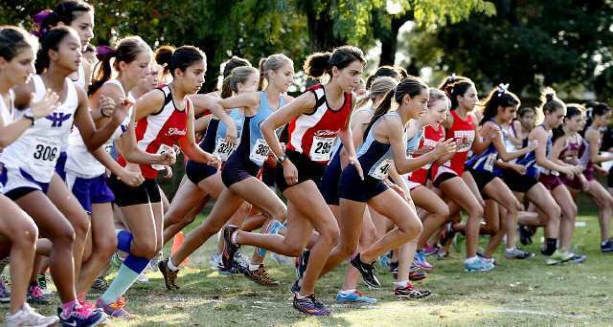 The girls' varsity cross country start at a Pacific League meet at County Park in Arcadia.