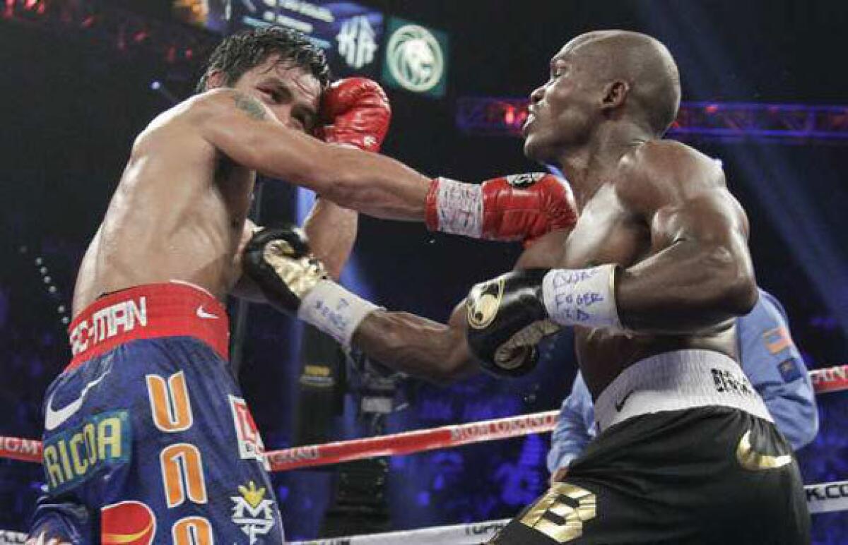 Manny Pacquiao and Tim Bradley during their fight on Saturday.