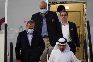 From left, Emad Sharghi, Morad Tahbaz and Siamak Namazi, former prisoners in Iran, walk out of a Qatar Airways flight that brought them out of Tehran and to Doha, Qatar, Monday, Sept. 18, 2023. Five prisoners sought by the U.S. in a swap with Iran were freed Monday and headed home as part of a deal that saw nearly $6 billion in Iranian assets unfrozen. (AP Photo/Lujain Jo)