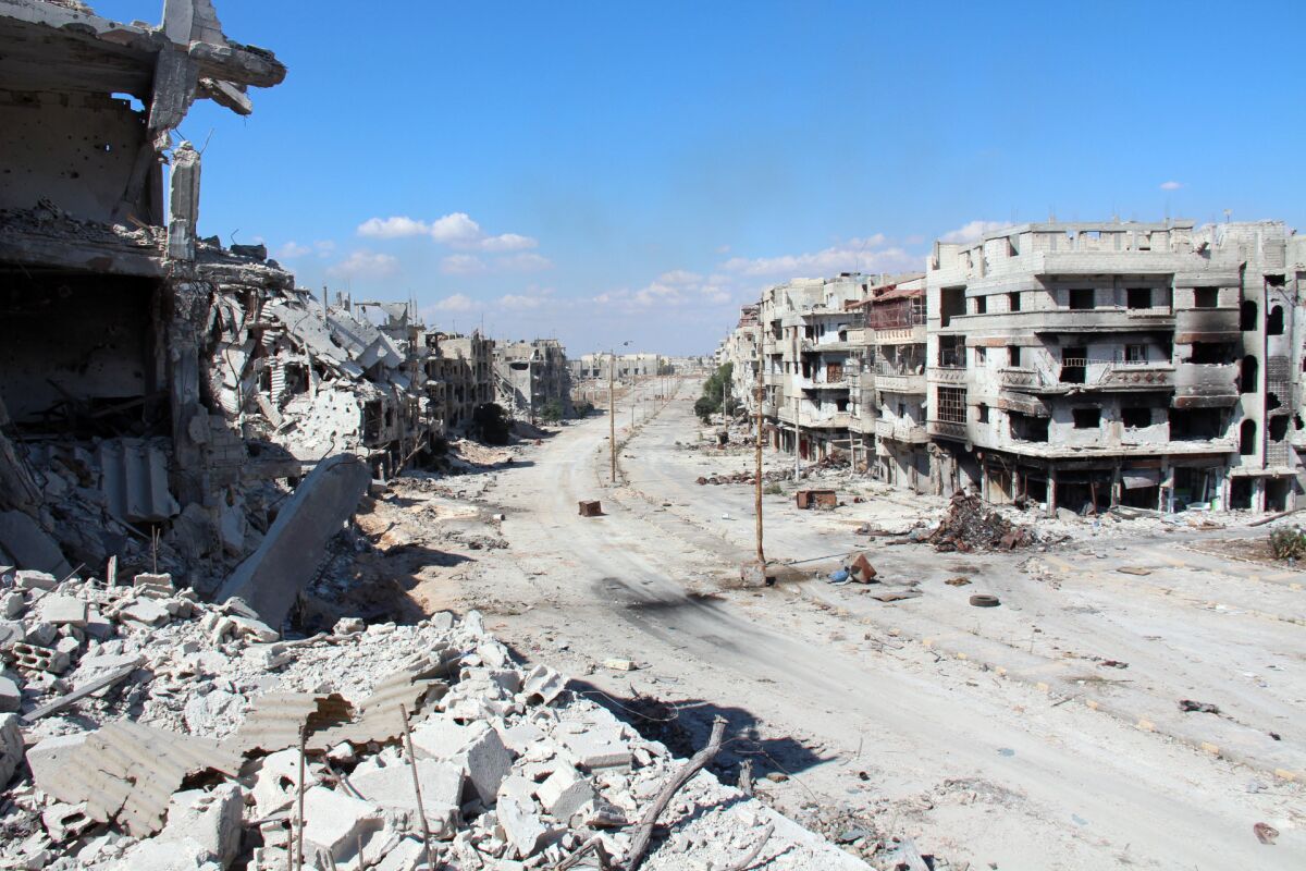 Hundreds of trapped Syrian civilians could leave the rebel-held center of Homs, pictured in September, in what appears to be the first solid accomplishment of the Geneva peace talks.