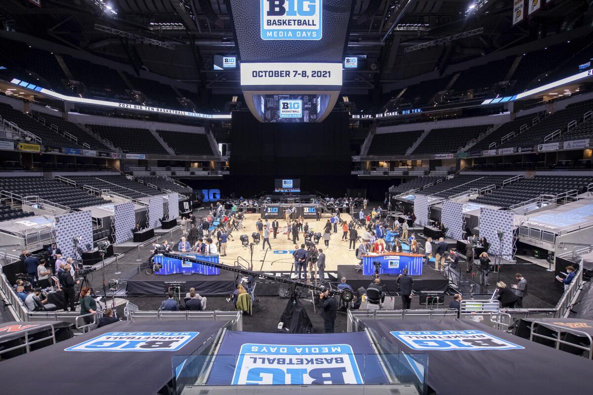 Players and coaches address the media during the first day of the Big Ten NCAA college basketball media days, Thursday, Oct. 7, 2021, in Indianapolis. (AP Photo/Doug McSchooler)