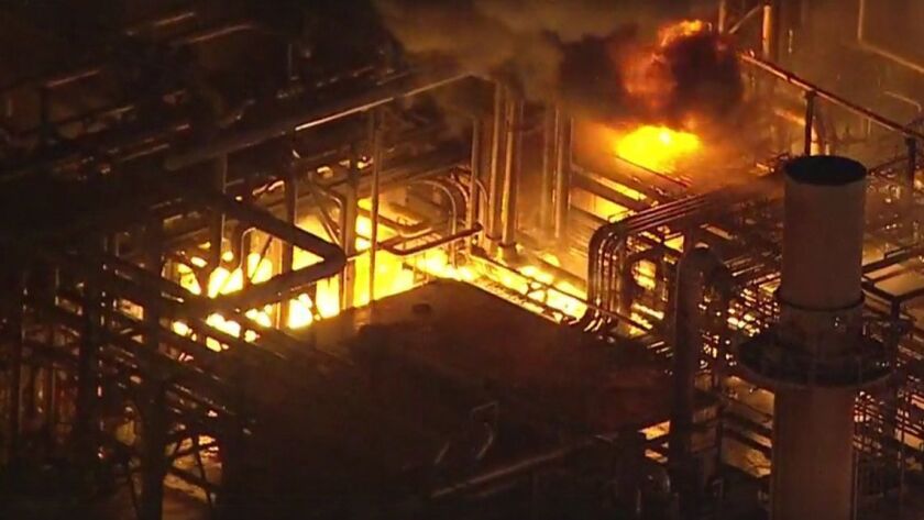 Firefighters battle flames at the Phillips 66 refinery in Carson on March 15, 2019.