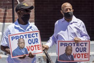 Henry Allen, left, and Charles Mauldin stand for the protection of voting rights at the John Lewis Advancement Act Day of Action, a voter education and engagement event taking place at Brown Chapel A.M.E. Church, Saturday, May 8, 2021, in Selma, Ala. Both men participated in the 1964 - 1965 Selma civil rights movement. (AP Photo/Vasha Hunt)