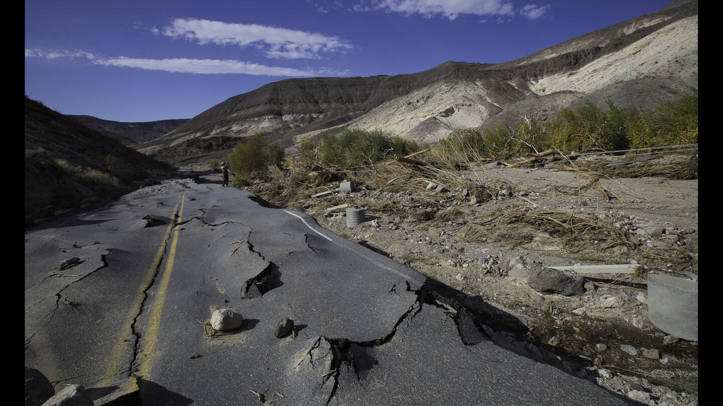 A 100-yard-long section of newly paved Highway 267 in Grapevine Canyon, a two-lane road designed to withstand severe flooding, was lifted up by roiling floodwaters and then slammed down on boulders in Death Valley National Park.