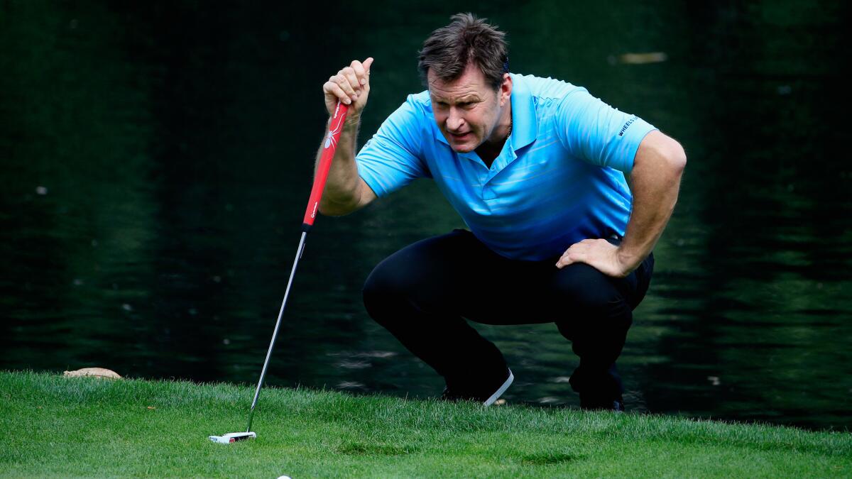 Nick Faldo lines up a putt during the Par 3 Contest prior to the start of the Masters at Augusta National Golf Club on April 8.