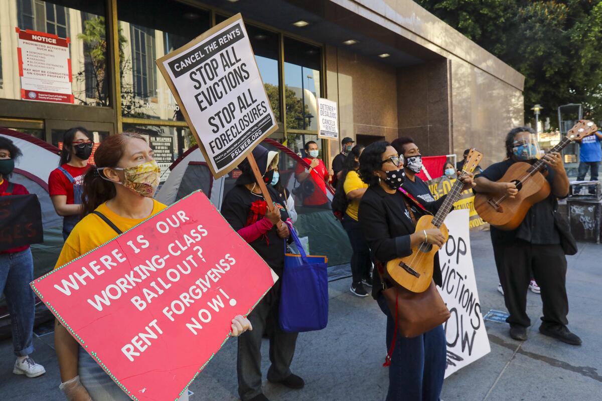 Tenants and housing rights organizers rally at Stanley Mosk Courthouse in Los Angeles to protest eviction orders.