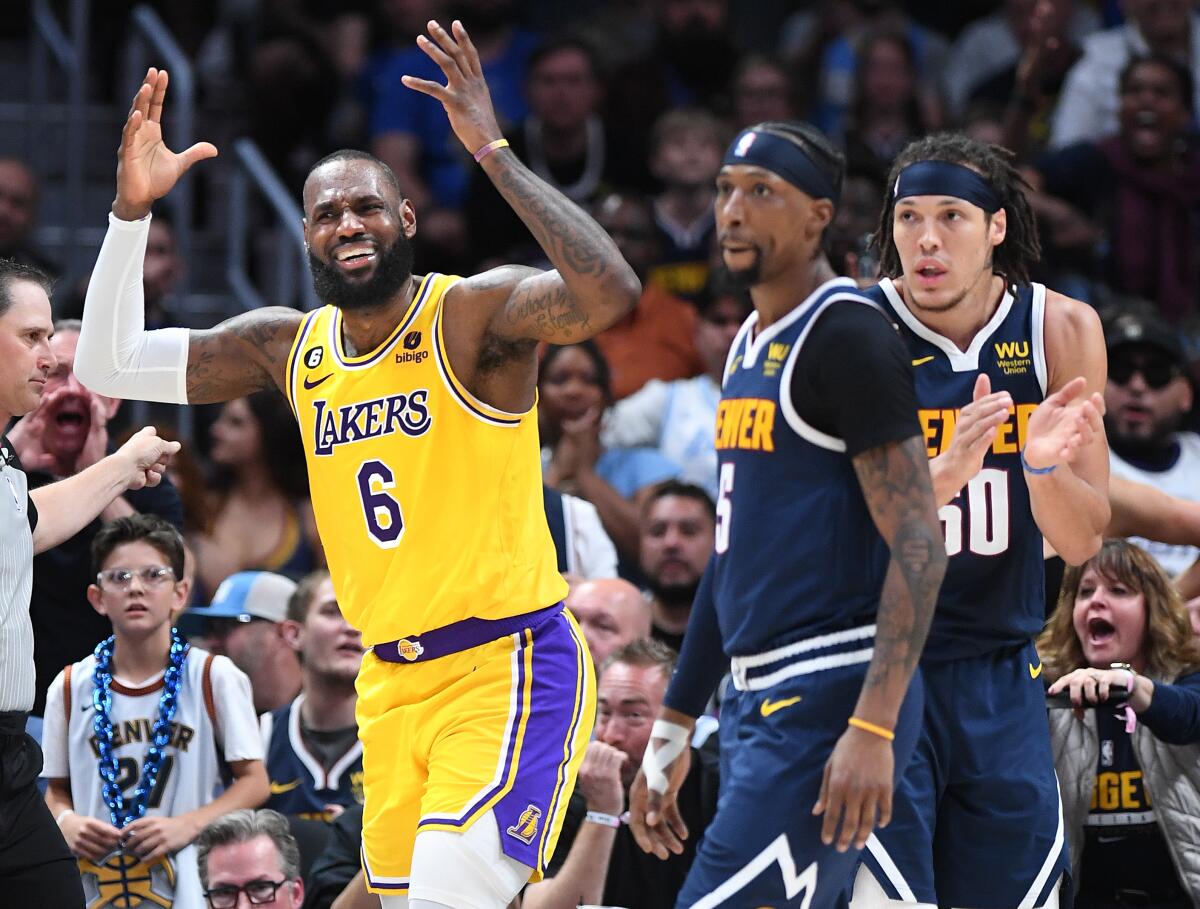 Lakers star LeBron James pleads for a foul call during the first quarter of the Lakers' 108-103 loss to the Denver Nuggets.