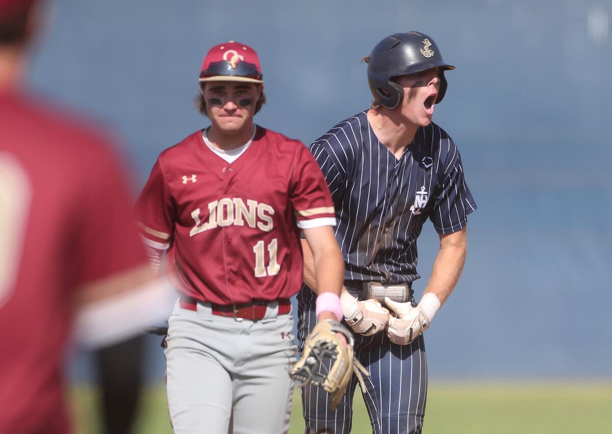 Newport Harbor's Trent Liolios, right, gets fired up after reaching second base against Oaks Christian on Tuesday.