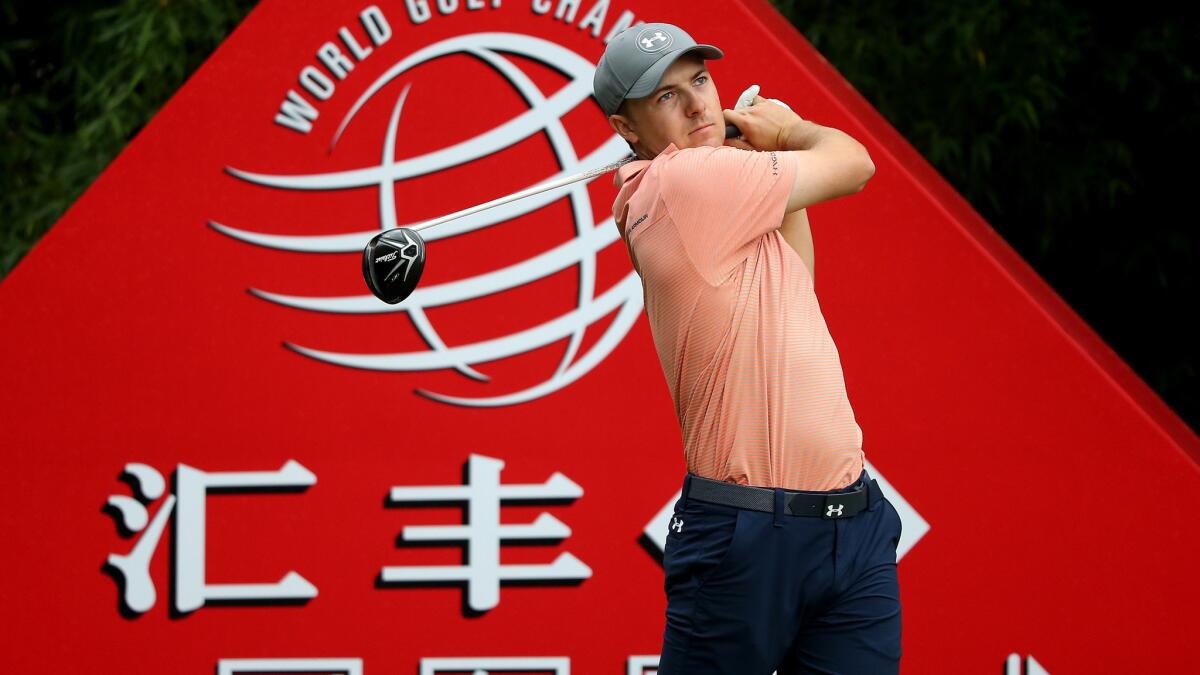 Jordan Spieth follows through on his tee shot at No. 2 during the third round of the HSBC Champions golf tournament Saturday.