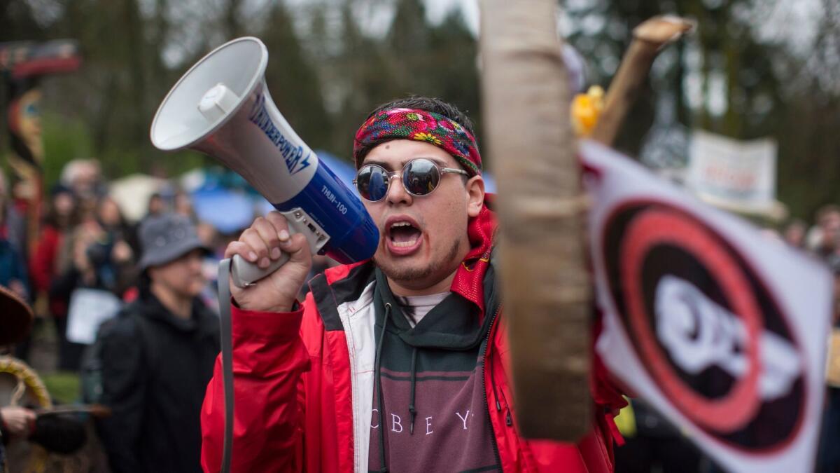 Cedar George-Parker addresses a rally in Burnaby, British Columbia, in April to protest Kinder Morgan's plan to extend the Trans Mountain oil pipeline.