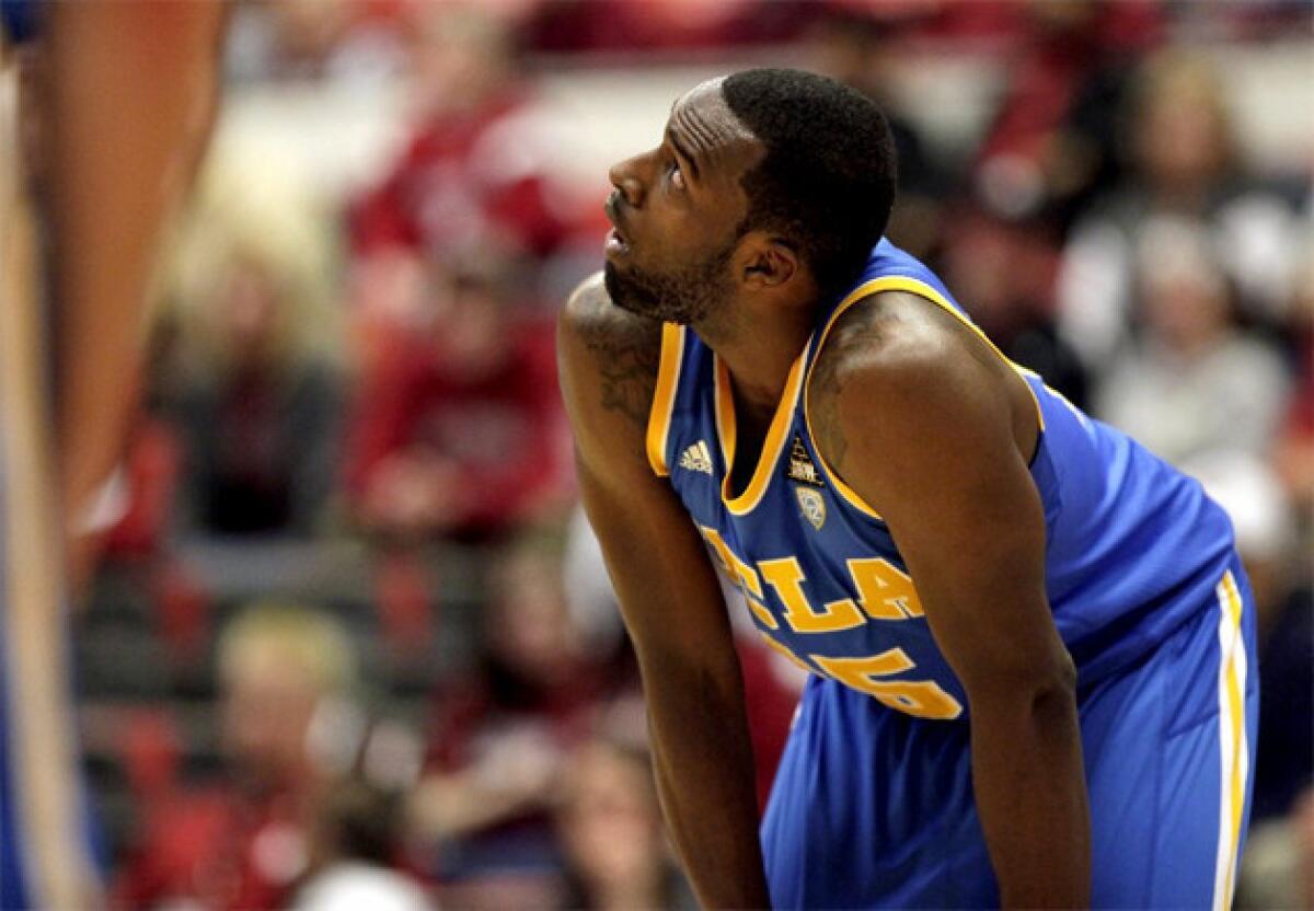 UCLA guard Shabazz Muhammad (15) looks at the scoreboard while waiting for a Washington State player to shoot a free throw.