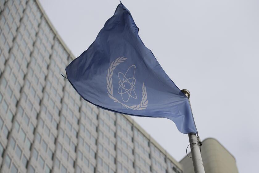 FILE - The flag of the International Atomic Energy Agency flies in front of its headquarters during an IAEA Board of Governors meeting in Vienna, Austria, on Feb. 6, 2023. (AP Photo/Heinz-Peter Bader, File)