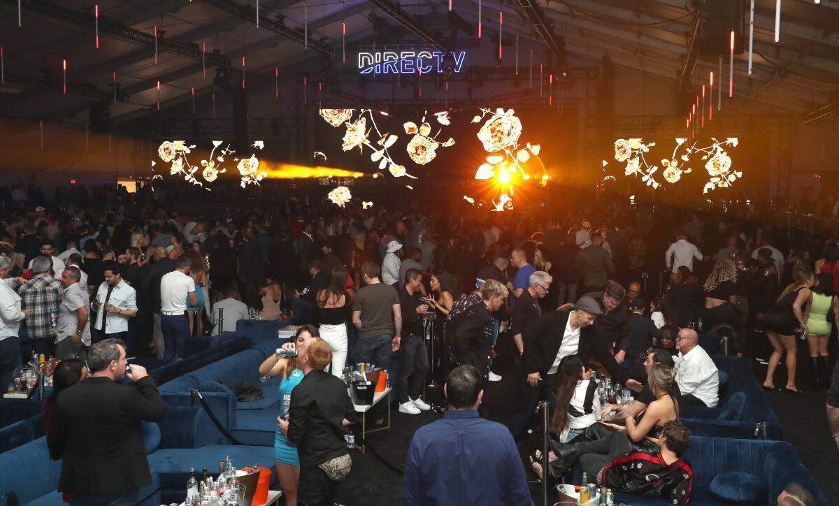 Guests under the tent at "Electric Nights With Maxim" on Saturday